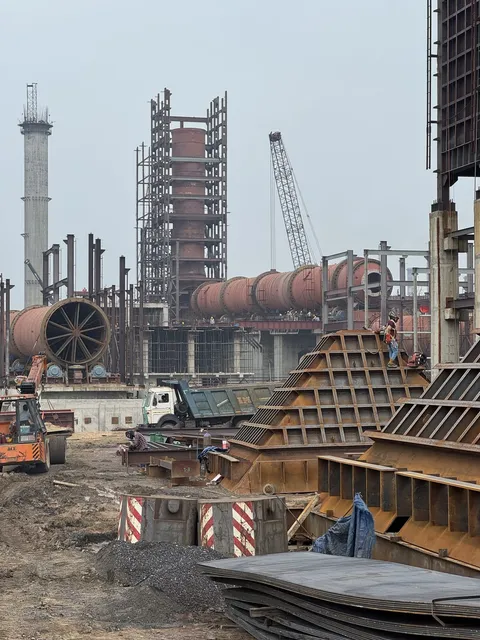 Rotary kiln and structural steelwork at a plant construction site