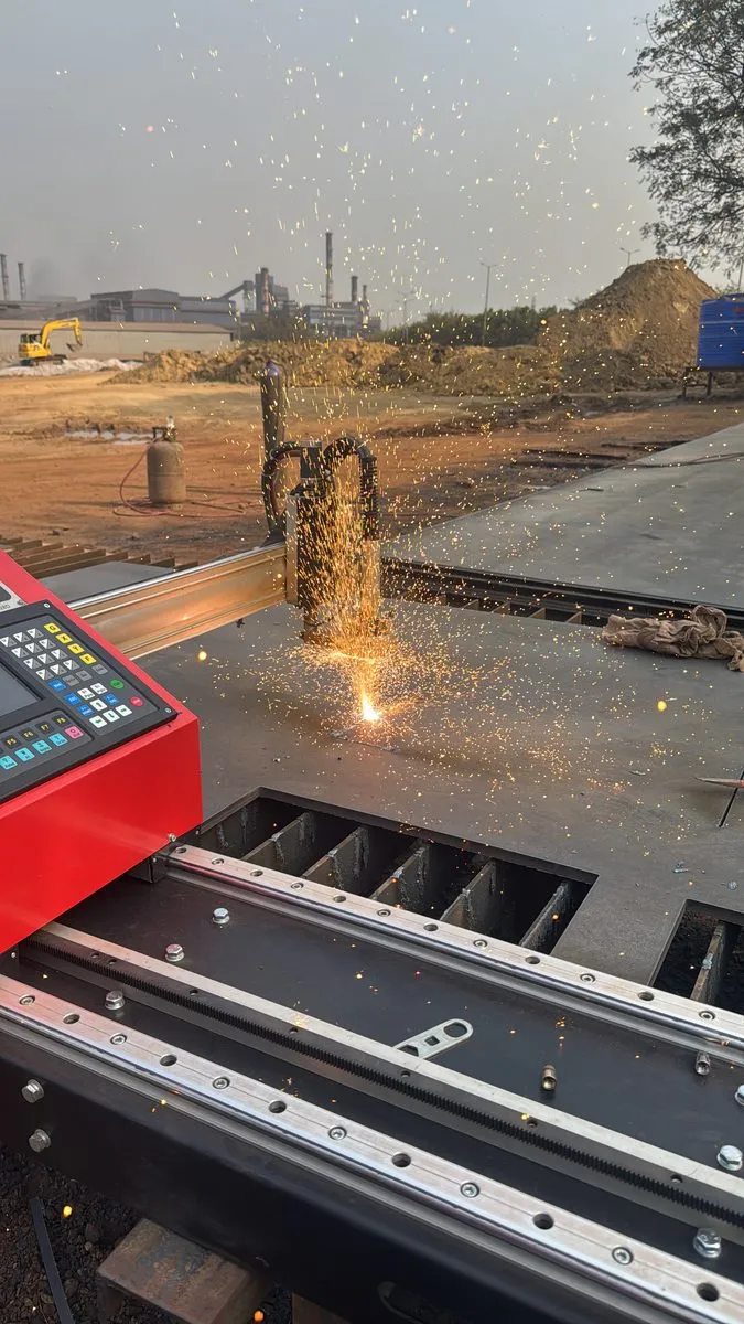 Plasma cutting machine at work on a steel plate
