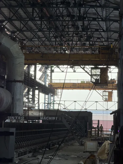 Steel shed interior with overhead crane and structural framework