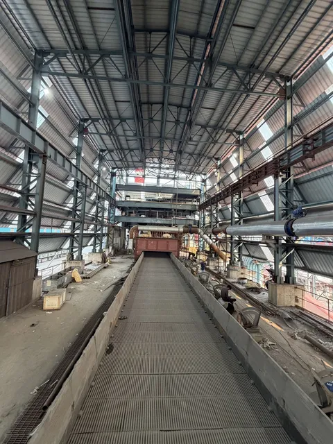 Long steel-framed plant building with overhead crane