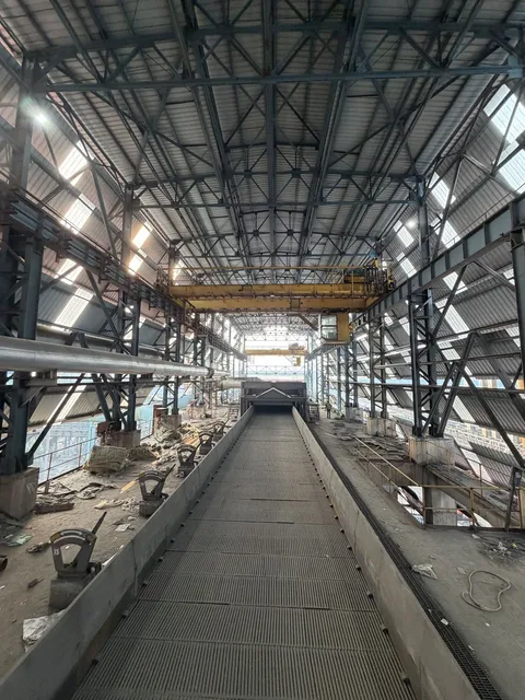 Long steel-framed plant building with overhead crane